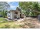 A beautiful backyard with a concrete patio, wooden deck, and firepit offers an inviting outdoor space at 747 Saint Michaels Ln # 7, Gastonia, NC 28052