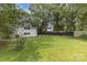 The expansive backyard is level and grassy, enclosed by a dark stained fence at 747 Saint Michaels Ln # 7, Gastonia, NC 28052