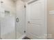 Elegant bathroom featuring a glass-enclosed shower with sleek marble tiles and a stylish mosaic floor pattern at 747 Saint Michaels Ln # 7, Gastonia, NC 28052