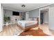 Bedroom with an accent wall, a painted brick fireplace, and a guitar at 747 Saint Michaels Ln # 7, Gastonia, NC 28052