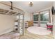 Cozy bedroom featuring a lofted bed, a dresser, and a round pink rug, creating a comfortable space at 747 Saint Michaels Ln # 7, Gastonia, NC 28052