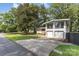 Charming two-story home with a two car garage and lush greenery in the front yard at 747 Saint Michaels Ln # 7, Gastonia, NC 28052