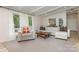 Comfortable living room featuring large windows, neutral colors, and ample seating at 747 Saint Michaels Ln # 7, Gastonia, NC 28052