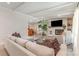 Bright living room with a white brick fireplace, large windows, and comfortable furniture at 747 Saint Michaels Ln # 7, Gastonia, NC 28052
