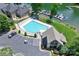Stunning aerial view of a waterfront property, showcasing the pool, lakeside community and boat docks at 7881 Mariners Pointe Cir, Denver, NC 28037