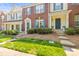 Charming townhome with a brick front, blue shutters, and well-maintained landscaping at 7881 Mariners Pointe Cir, Denver, NC 28037