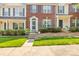 Attractive brick townhome with blue shutters, neat landscaping, and a welcoming entrance at 7881 Mariners Pointe Cir, Denver, NC 28037