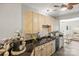 Well-lit kitchen featuring stainless steel appliances, black granite countertops, and a mosaic backsplash at 7881 Mariners Pointe Cir, Denver, NC 28037