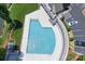 Aerial view of a beautiful community pool with blue water, modern decking and plenty of space to relax and unwind at 7881 Mariners Pointe Cir, Denver, NC 28037