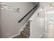 Staircase with modern design and grey accents, leading to the upper level at 7881 Mariners Pointe Cir, Denver, NC 28037