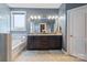Bathroom featuring a tub, double vanity with granite counters, and lots of natural light at 8340 Breton Way, Harrisburg, NC 28075