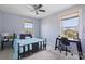Cozy bedroom featuring a bed, desk, and windows offering plenty of natural light at 8340 Breton Way, Harrisburg, NC 28075