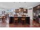 Spacious kitchen featuring a large center island, stainless steel appliances, and warm wood accents at 8340 Breton Way, Harrisburg, NC 28075