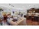 Open concept living room with hardwood floors, view into dining area and kitchen at 8340 Breton Way, Harrisburg, NC 28075