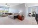 Bright, open living area with large windows, stylish sofas, and a decorative chest at 8340 Breton Way, Harrisburg, NC 28075