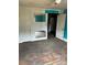 Bedroom with two closets and aged hardwood floors presenting an opportunity for renovation at 839 S Chester St, Gastonia, NC 28052