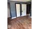 Empty bedroom showcasing hardwood floors and neutral-toned walls, ready for personalization at 839 S Chester St, Gastonia, NC 28052