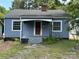 Charming single-story home featuring a covered entry, quaint front yard, and classic architectural details at 839 S Chester St, Gastonia, NC 28052