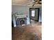 Living room features hardwood floors, a decorative fireplace, and neutral-colored walls needing some TLC at 839 S Chester St, Gastonia, NC 28052
