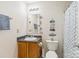 Bathroom with sink, toilet, and shower, decorated with beach-themed decor at 925 Skywatch Ln, Monroe, NC 28112
