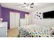 Bright bedroom featuring playful polka dot bedding, a ceiling fan, and charming decor at 925 Skywatch Ln, Monroe, NC 28112