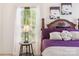 Comfortable bedroom featuring purple bedding, natural light, and modern lamp at 925 Skywatch Ln, Monroe, NC 28112