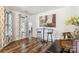 Dining area features decorative artwork, elegant furnishings, attractive curtains and hardwood flooring at 925 Skywatch Ln, Monroe, NC 28112