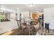 Comfortable dining area with seating for four adjoins an open concept kitchen and living space at 925 Skywatch Ln, Monroe, NC 28112