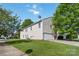 Two-story home featuring a neutral siding, attached garage, and a well-manicured lawn at 925 Skywatch Ln, Monroe, NC 28112
