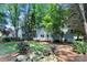 Backyard with a deck and mature trees at 9513 Saddle Run Trl, Charlotte, NC 28269