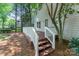 View of spacious backyard deck with white railings and stained wood floors at 9513 Saddle Run Trl, Charlotte, NC 28269