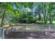 Relaxing wooded backyard view from the spacious deck at 9513 Saddle Run Trl, Charlotte, NC 28269
