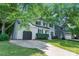Charming two-story home features a well-maintained yard, a driveway, and a one-car garage at 9513 Saddle Run Trl, Charlotte, NC 28269