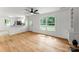 Open-concept living area with hardwood floors and natural light, ideal for relaxing or entertaining guests at 9513 Saddle Run Trl, Charlotte, NC 28269