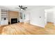 Spacious living room features hardwood floors, a fireplace with built-ins, and plenty of natural light at 9513 Saddle Run Trl, Charlotte, NC 28269