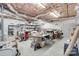 Unfinished basement features concrete floor, exposed ceiling, utility connections, and shelving at 103 3Rd Sw St, Catawba, NC 28609