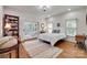 Bright bedroom features hardwood floors, a decorative rug, and access to an outdoor patio at 103 3Rd Sw St, Catawba, NC 28609