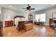 Bedroom featuring hardwood floors, a ceiling fan, and large windows at 103 3Rd Sw St, Catawba, NC 28609