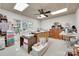 Bonus room featuring a ceiling fan, natural light, shelving, and ample storage at 103 3Rd Sw St, Catawba, NC 28609