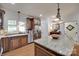 Bright kitchen featuring granite counters, stainless steel appliances, a large center island and hardwood floors at 103 3Rd Sw St, Catawba, NC 28609
