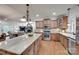 A kitchen with a large island, stainless steel appliances, and wooden cabinets at 103 3Rd Sw St, Catawba, NC 28609