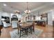 Open concept living area with a fireplace, hardwood floors, and a kitchen in the background at 103 3Rd Sw St, Catawba, NC 28609