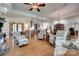Open living room area with hardwood floors, modern furnishings, and seamless transition to the kitchen and dining area at 103 3Rd Sw St, Catawba, NC 28609