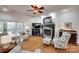Spacious living room featuring a cozy fireplace, elegant furniture, and a view of the outdoor patio at 103 3Rd Sw St, Catawba, NC 28609