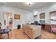 Office with hardwood floors, a large desk, and a window with blinds at 103 3Rd Sw St, Catawba, NC 28609