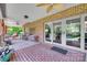 Covered brick patio includes white rockers, a ceiling fan, and sliding door entry to the home at 103 3Rd Sw St, Catawba, NC 28609