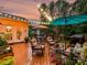 Inviting back deck featuring comfortable seating, a dining area, an umbrella, and stylish decor with decorative planters at 105 Beech Bluff Dr, Mount Holly, NC 28120