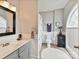Cozy bathroom with a granite vanity top, and ceramic flooring at 105 Beech Bluff Dr, Mount Holly, NC 28120