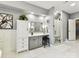 Modern bathroom with a walk-in shower, vanity with seated makeup area, and sleek white cabinets at 105 Beech Bluff Dr, Mount Holly, NC 28120