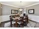 Dining room featuring hardwood floors, modern chandelier and decorative mirror at 105 Beech Bluff Dr, Mount Holly, NC 28120